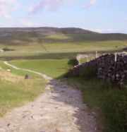 Limestone hills and dry-stone walls in the west of the Yorkshire Dales. This part of the national park is popular with walkers due to the presence of the Yorkshire three peaks.
