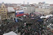 President George W. Bush and Slovakia's former Prime Minister Mikuláš Dzurinda are greeted by a crowd of thousands gathered in Bratislava's Hviezdoslavovo Square