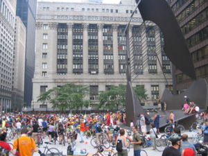 A Critical Mass gathering on the Daley Plaza, with Chicago City Hall in the background and Chicago Picasso on the right