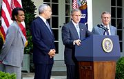 Rice, Secretary of State Colin Powell, and Secretary of Defense Donald Rumsfeld listen to President George W. Bush speak about the Middle East on June 24, 2002