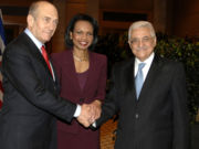 Rice meets with Israeli Prime Minister Ehud Olmert and Palestinian President Mahmoud Abbas at a trilateral meeting in Jerusalem, February 2007.
