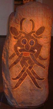 The iconic late Viking Age Mask Stone found in Aarhus, housed at the Moesgård Museum.