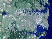 Image of Sydney taken by NASA RS satellite. The city centre is about a third of the way in on the south shore of the upper inlet, the Parramatta River, directly south of the Sydney Harbour Bridge