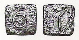 A coin of Menander I with an eight-spoked wheel and a palm of victory on the reverse (British Museum).