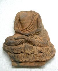 Tile with seated Buddha, Nara Prefecture, Asuka period, 7th century. Tokyo National Museum.