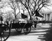 Kennedy's casket departs the White House