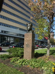 Bust of JFK, with President Kennedy pavilion behind, on President Kennedy Ave in Montreal