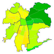 Santiago by Human Development Index on a commune-basis. Greener is higher. The blue line divides the formal areas of the city.