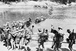 A Chindit column crossing a river in Burma.