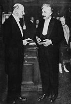 Max Planck presents Albert Einstein with the Max-Planck medal in 1929.