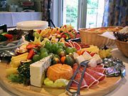 A typical cheese and cold meat buffet served at private festivities.
