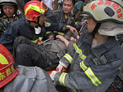 This elderly woman was rescued and placed on a stretcher after being trapped for over 50 hours.