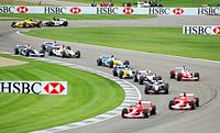 Cars wind through the infield section of the Indianapolis Motor Speedway at the 2003 United States Grand Prix.