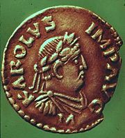 A coin of Charlemagne bearing his effigy and the inscription KAROLVS IMP AVG