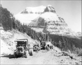 Road construction along the Going-to-the-Sun Road with Going to the Sun Mountain in background, 1932.