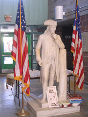 A marble statue of Benjamin Franklin stands in the atrium of Benjamin Franklin High School in New Orleans, Louisiana