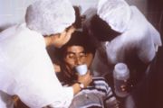 Cholera patient being treated by medical staff in 1992.