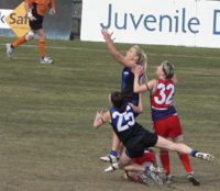 A Women's Australian rules football Match between the Melbourne University Mugars and the Darebin Falcons.