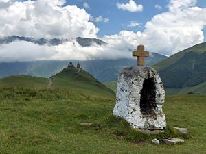 Tsminda Sameba church, 2200 m high, Caucasus mountains in the back, rising more than 4000 m above sea level.
