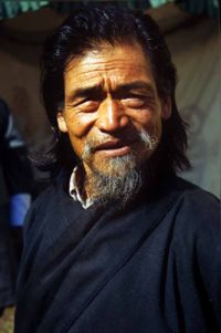 Senior Bhutanese man in national dress.