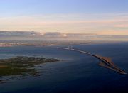 Øresund Bridge from Denmark to Sweden. On the right is the artificial Peberholm island, and on the left Saltholm. Picture is taken from the air.