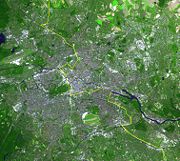 Satellite image of Berlin, with the wall's location marked in yellow.
