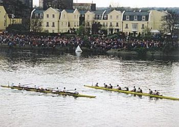 Exhausted crews at the finish of the 2002 Boat Race.  Cambridge are on the left of the picture.