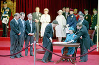 The Constitution Act, 1982 during the official signing ceremony by Queen Elizabeth II in Ottawa on April 17, 1982 which accepted the act and gave the Government of Canada full control over Canada's constitution.