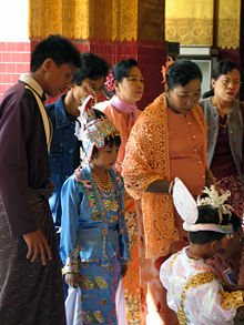 An ear-piercing ceremony at the Mahamuni Pagoda in Mandalay is one of the many coming-of-age ceremonies in Burmese culture.