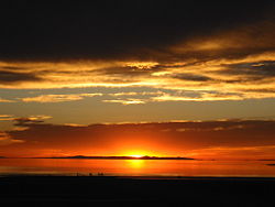 Sunset viewed from the western shore of Antelope Island. Carrington Island is visible in the distance.