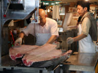 Tuna cut in half for processing at the Tsukiji fish market in Tokyo, Japan.