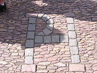 The "cursed" cobblestone initials outside St Salvators Quadrangle.
