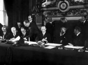 The National Bloc signing the Franco-Syrian Treaty of Independence in Paris in 1936. From left to right: Saadallah al-Jabiri, Jamil Mardam Bey, Hashim al-Atassi (signing), and French Prime Minister Léon Blum.