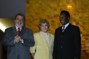 Pelé, right, with Brazil President Luiz Inácio Lula da Silva, left, and First Lady Marisa, July 13, 2004.