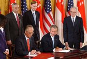 Prime Minister Goh Chok Tong and President of the United States George W. Bush signing the US-Singapore Free Trade Agreement in the White House, May 6, 2003.