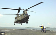 An RSAF CH-47SD lands aboard USS Rushmore during Exercise CARAT 2001