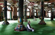 Muslims praying in the male section of a mosque in Srinagar, Jammu and Kashmir.