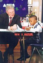 Clinton reading with a child in Chicago, September, 1998.