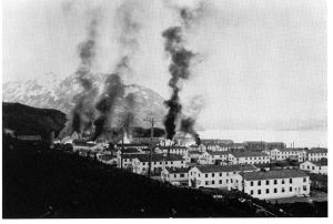 Buildings burning after the first enemy attack on Dutch Harbor, June 3, 1942.