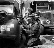 Princess Elizabeth changing a vehicle wheel during WWII
