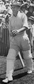 Bradman walking out to bat in the third Test against England at the Melbourne Cricket Ground in 1937. His 270 runs won the match for Australia and has been rated the greatest innings of all time.