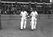 Bradman (left, with his vice-captain Stan McCabe) walks out to bat at Perth, during a preliminary match to the 1938 tour of England. Bradman scored 102.