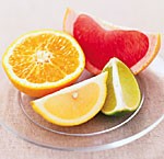 Slices of pink grapefruit, lime, lemon and orange (clockwise from top)