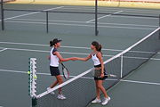 Convention dictates that two players shake hands at the end of a match.