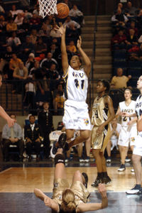 Player releases a short jump shot, while her defender is either knocked down, or trying to "take a charge."