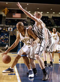 A U.S. Naval Academy ("Navy") player, left, posts up a U.S. Military Academy ("Army") defender