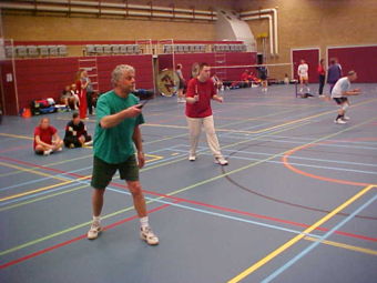 A mens doubles match, the blue lines are those for the badminton court. The other coloured lines denote uses for other sports - such complexity being common in multi-use sports halls