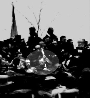 The only confirmed photo of Abraham Lincoln at Gettysburg  (seated), taken about noon, just after Lincoln arrived and some three hours before he spoke. To Lincoln's right is his bodyguard, Ward Hill Lamon.