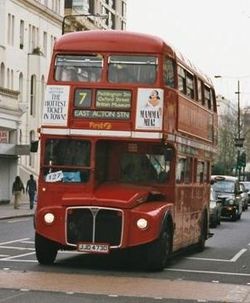 A London AEC Routemaster, RML 2473 (JJD 473D), on route 7 approaching Ladbroke Grove tube station in April 2002.