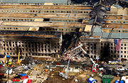 The Pentagon damaged by fire and partially collapsed.